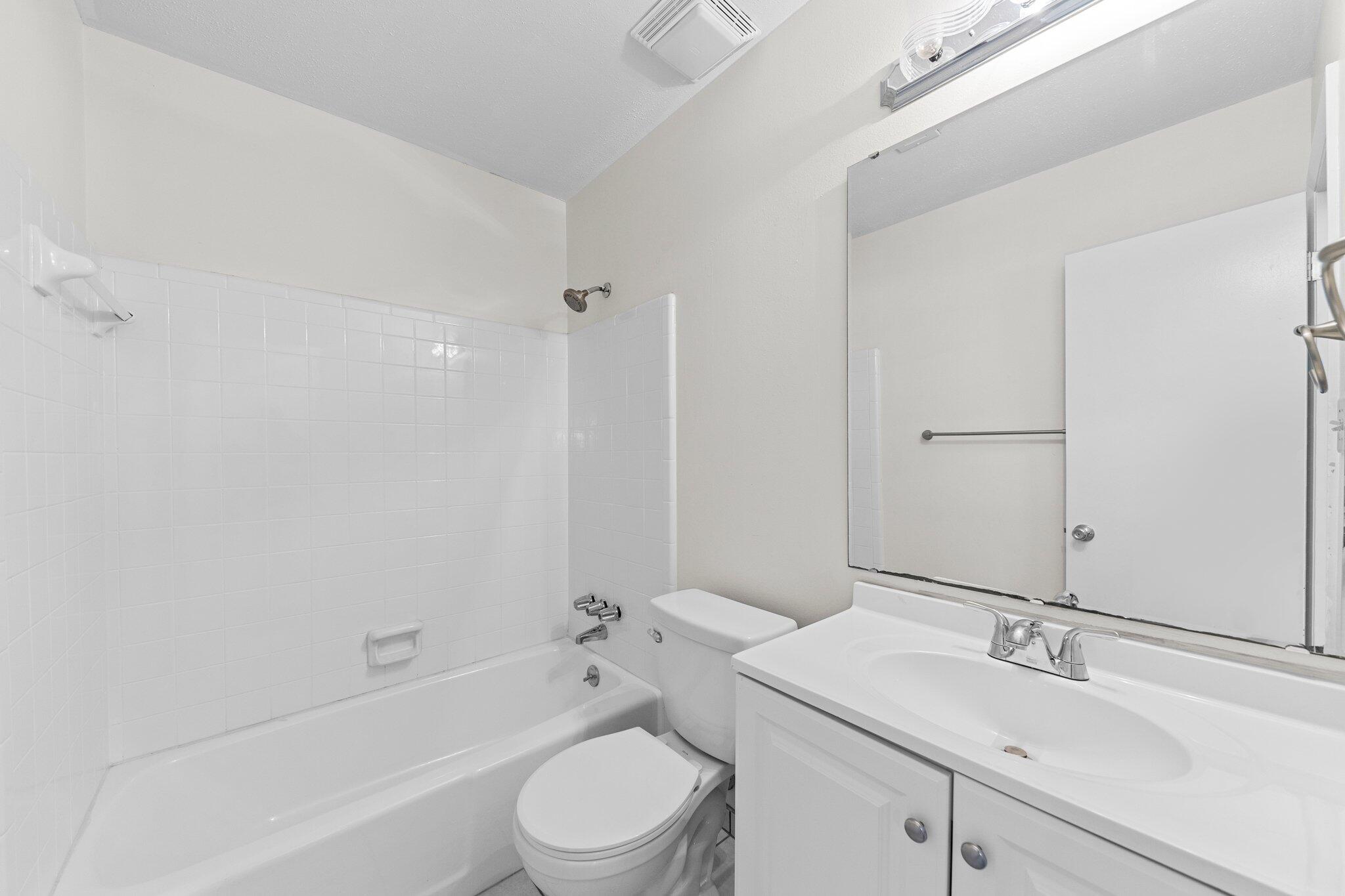 309 23rd Street Niceville, FL 32578 - Photo 23 of 33 a bathroom with a toilet a sink and a bathtub