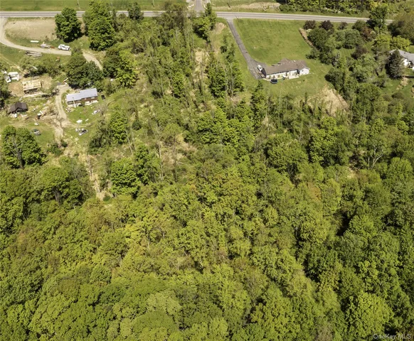 an aerial view of residential house with parking space