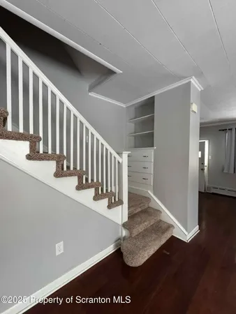a view of entryway with stairs