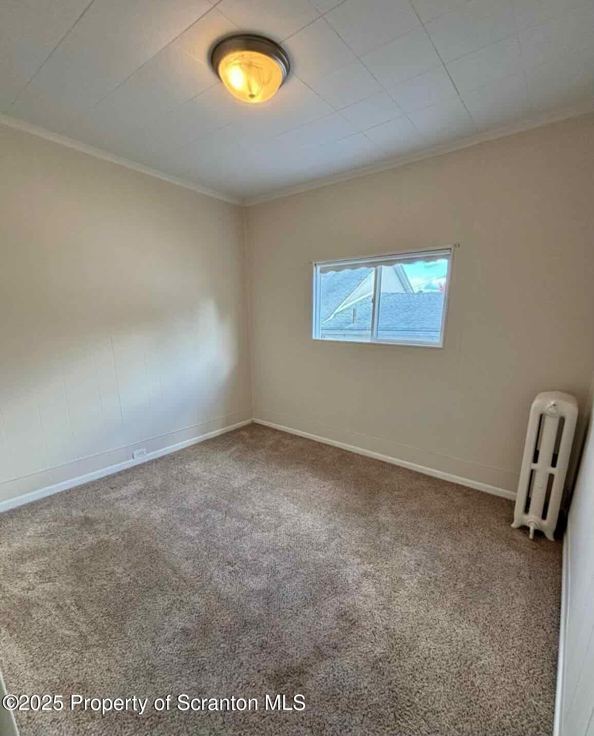 1406 Penn Avenue Scranton, PA 18509 - Photo 7 of 12 an empty room with a piano