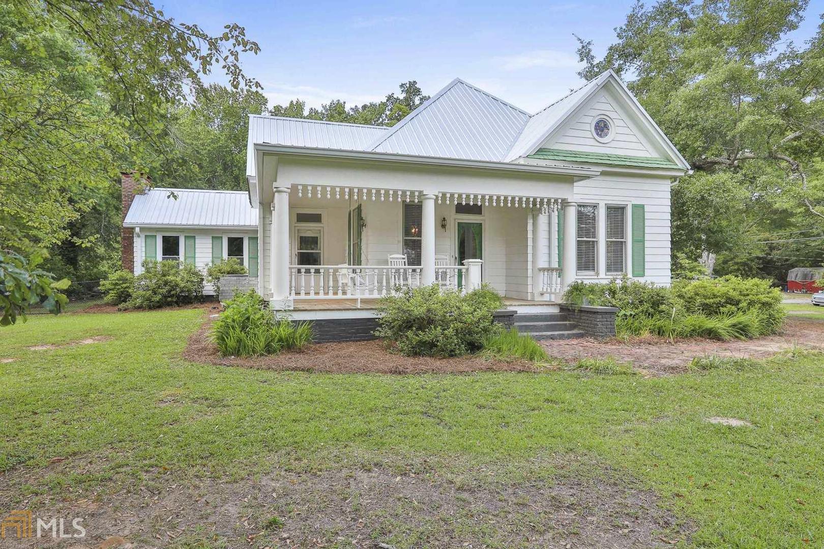 356 Rivertown Road Fairburn, GA 30213 - Photo 1 of 1 a front view of a house with a yard and porch
