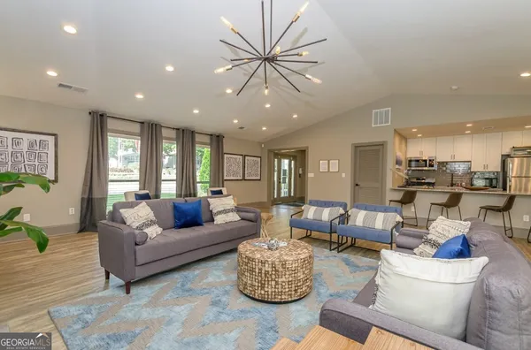 a living room with furniture and a large window