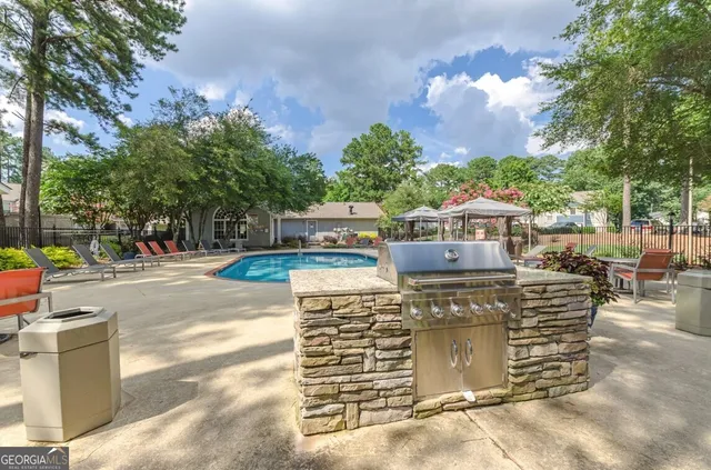 a view of a swimming pool with a lounge chair