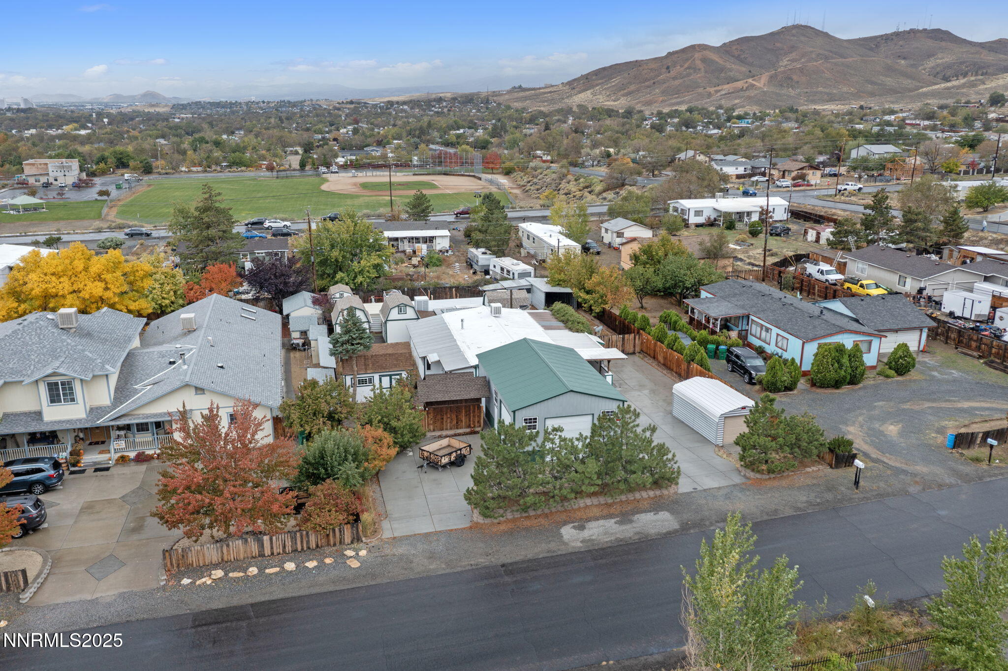 180 Staci Way Sun Valley, NV 89433 - Photo 15 of 71 an aerial view of a city with lots of residential buildings ocean and mountain view in back