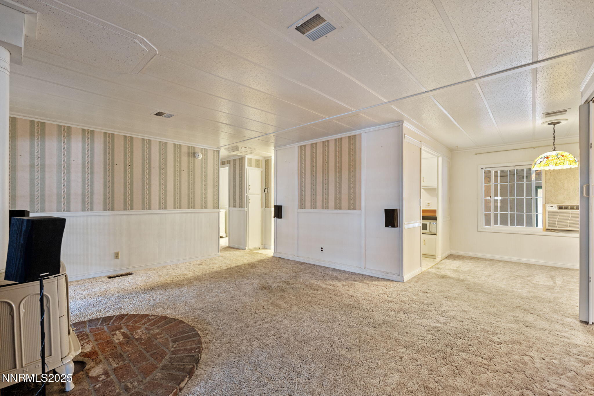 180 Staci Way Sun Valley, NV 89433 - Photo 19 of 71 a view of an empty room with a window