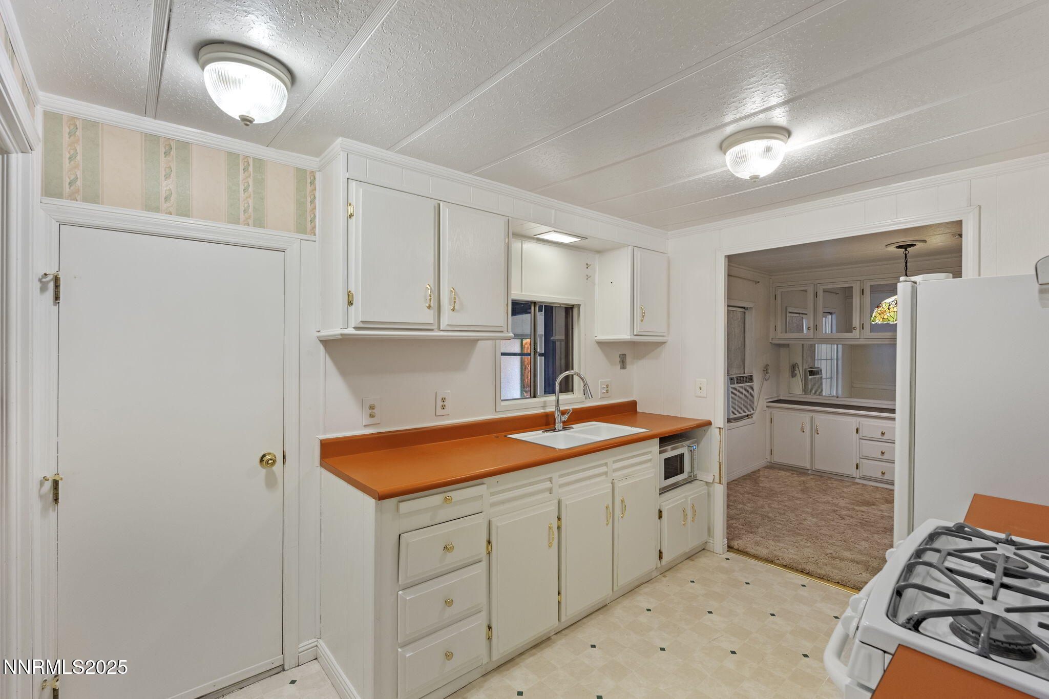 180 Staci Way Sun Valley, NV 89433 - Photo 24 of 71 a kitchen with stainless steel appliances granite countertop a sink and cabinets