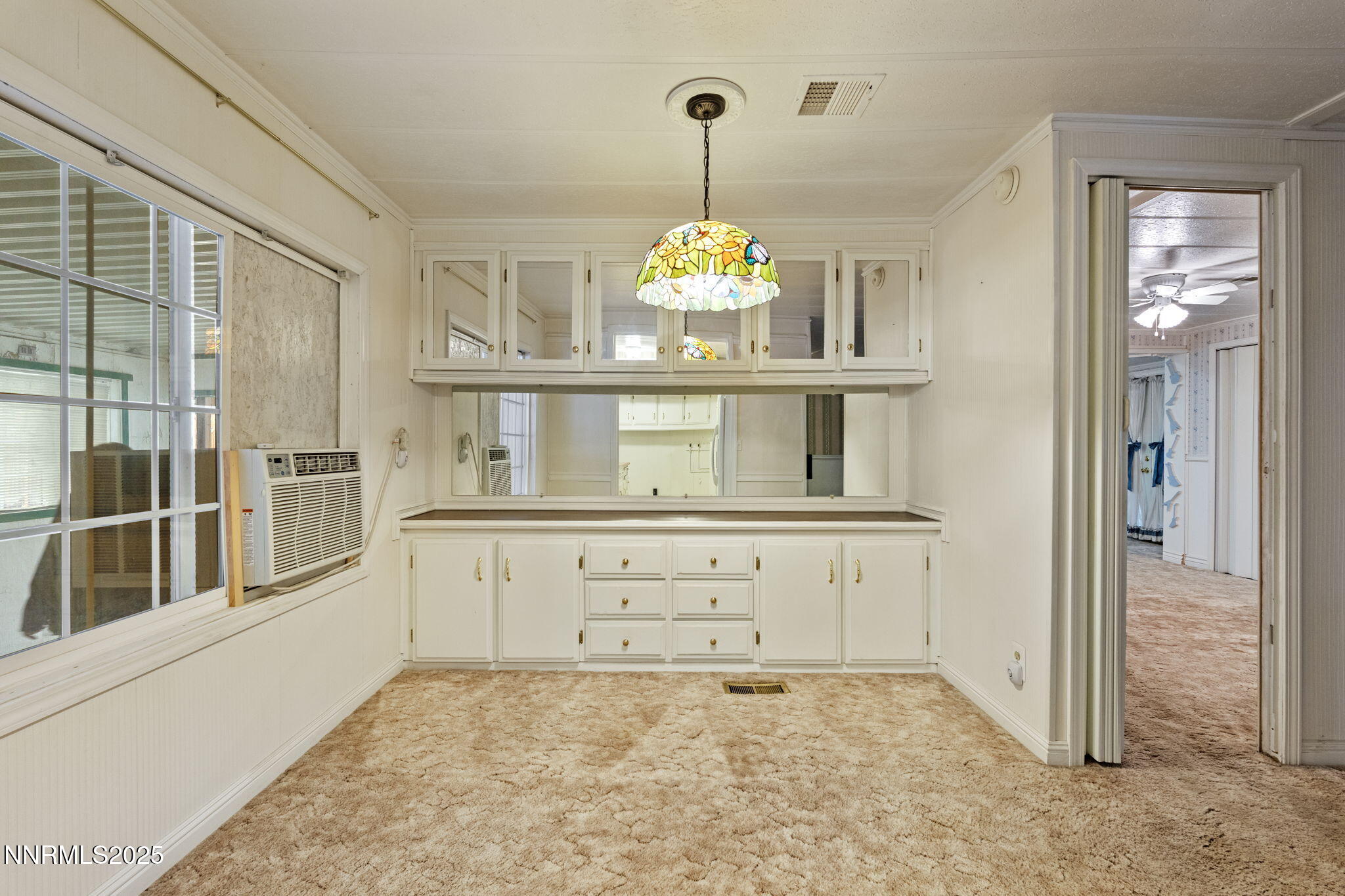 180 Staci Way Sun Valley, NV 89433 - Photo 28 of 71 a view of a hallway with chandelier