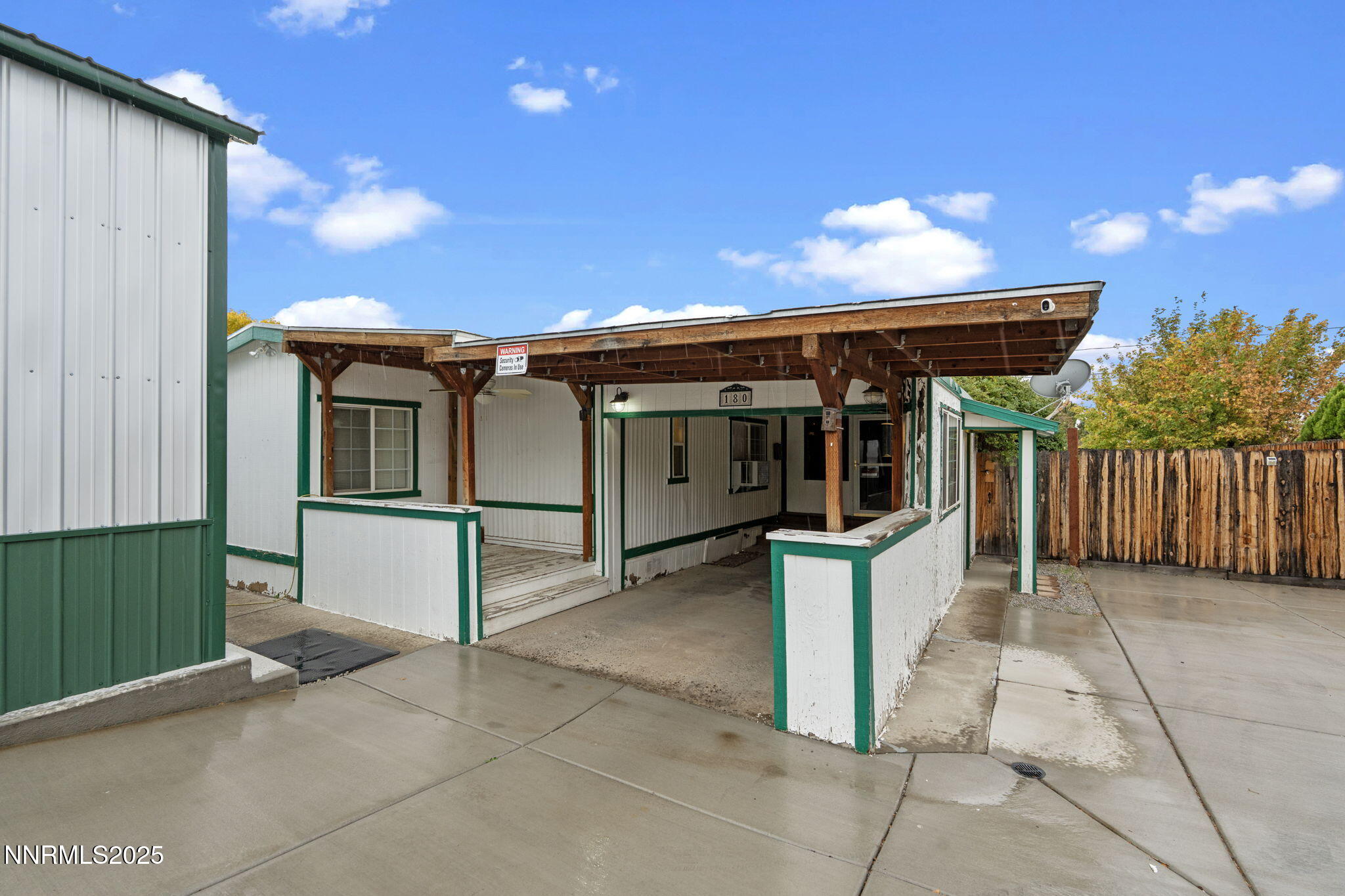 180 Staci Way Sun Valley, NV 89433 - Photo 3 of 71 a view of a house with a barbeque and wooden stairs