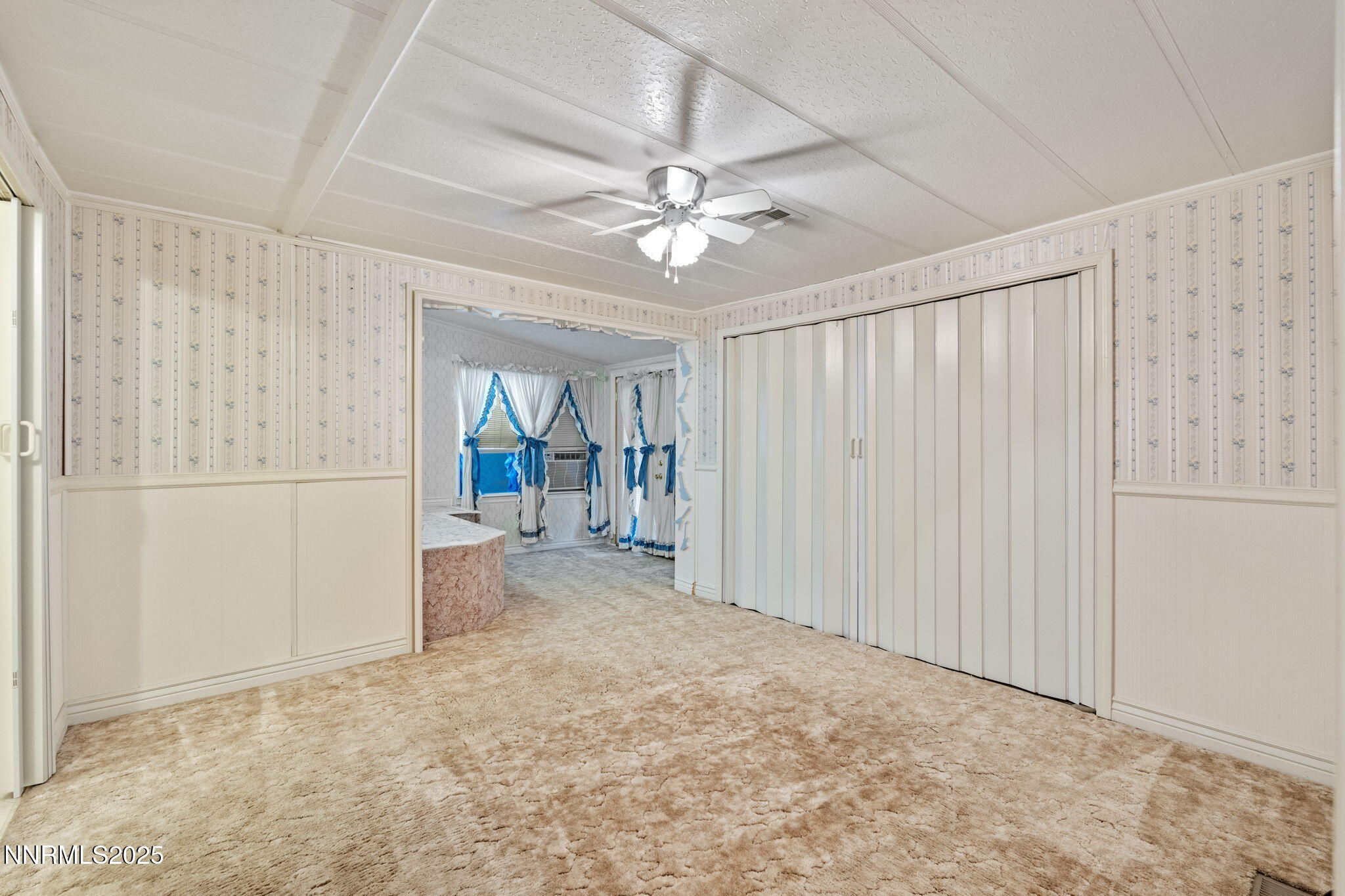 180 Staci Way Sun Valley, NV 89433 - Photo 32 of 71 a view of an empty room with a window