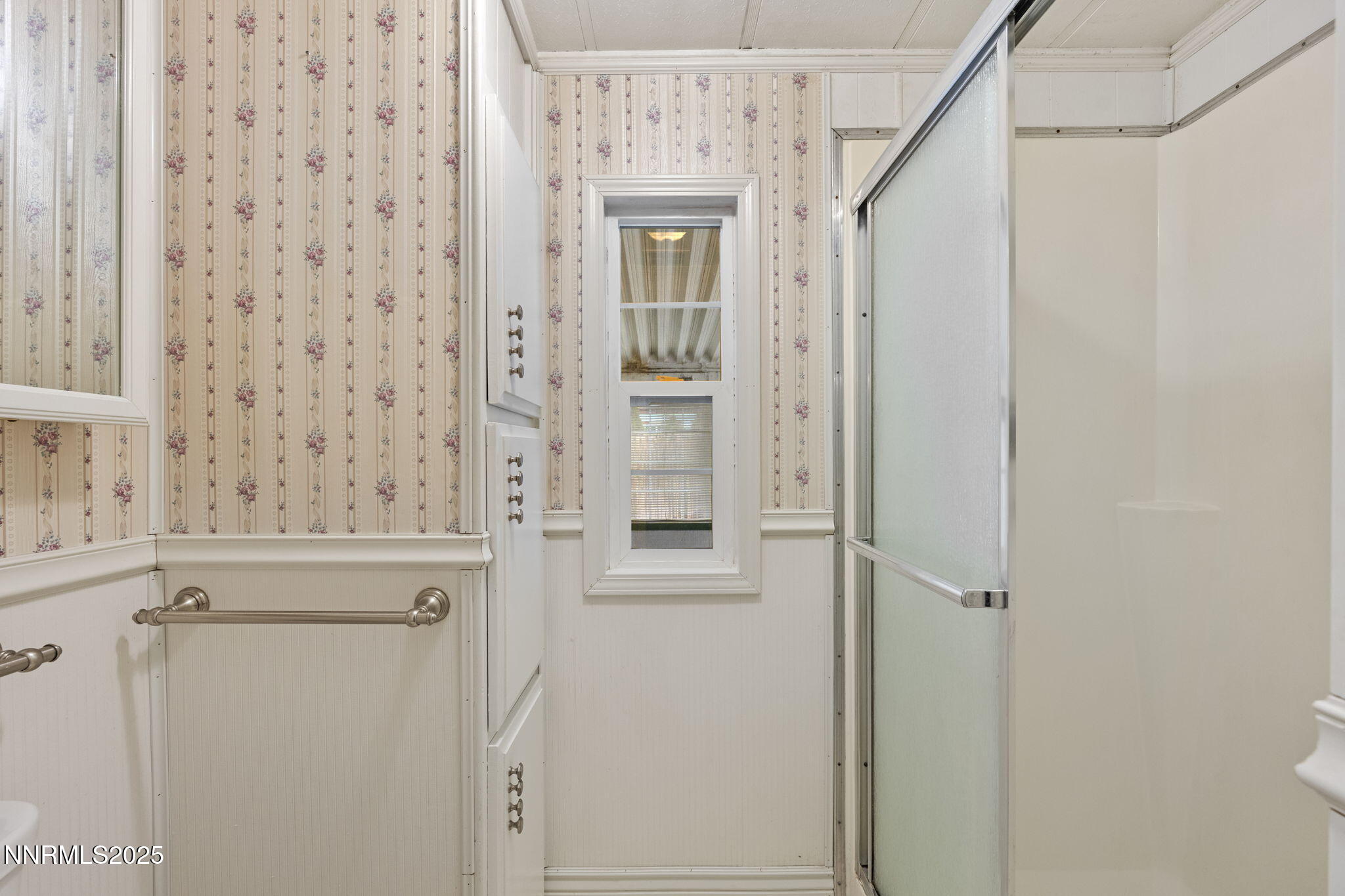 180 Staci Way Sun Valley, NV 89433 - Photo 37 of 71 a view of a hallway with wooden cabinets