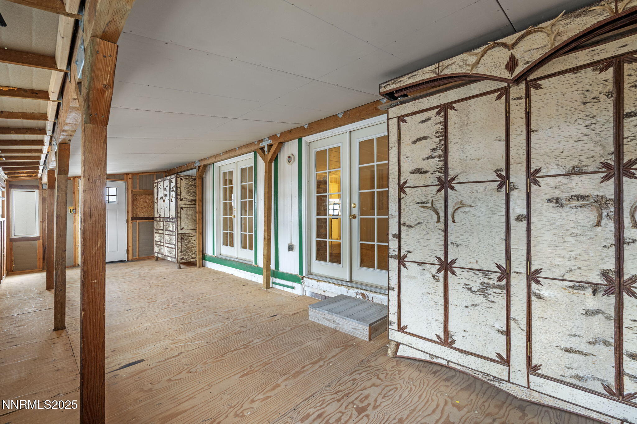 180 Staci Way Sun Valley, NV 89433 - Photo 39 of 71 a view of an entryway with wooden floor and door