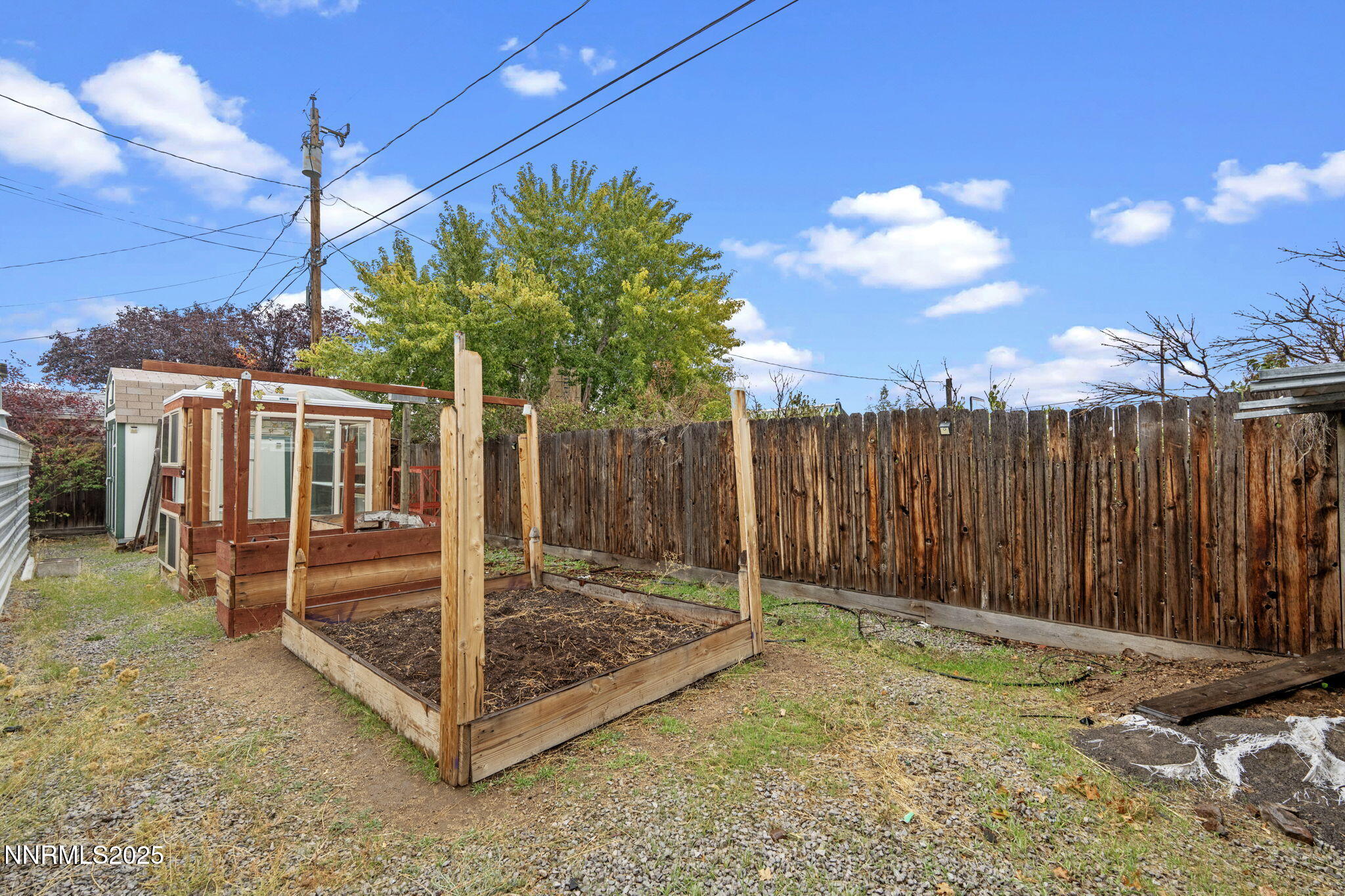 180 Staci Way Sun Valley, NV 89433 - Photo 47 of 71 a view of a backyard with a barn