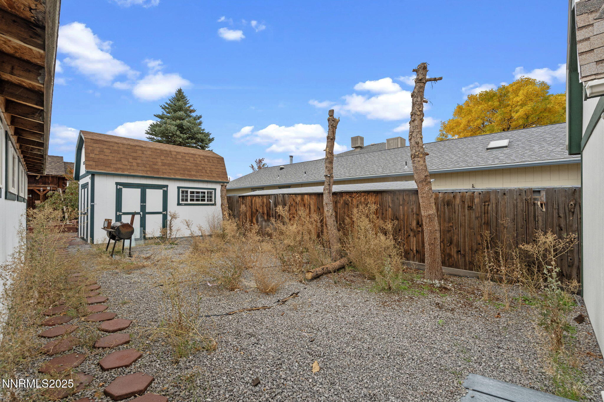 180 Staci Way Sun Valley, NV 89433 - Photo 54 of 71 a view of a house with backyard and wooden fence