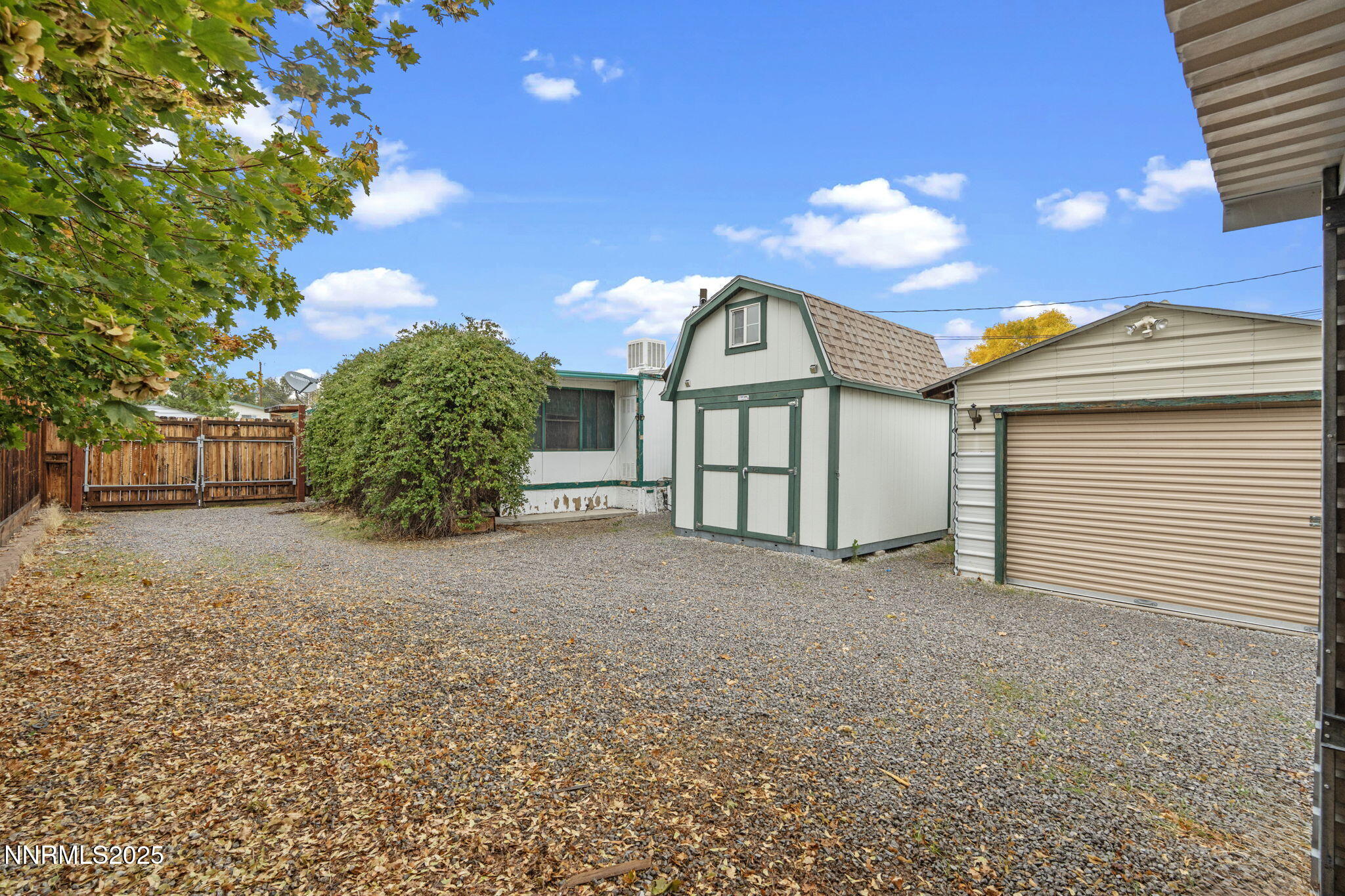 180 Staci Way Sun Valley, NV 89433 - Photo 56 of 71 a view of a house with a yard and garage