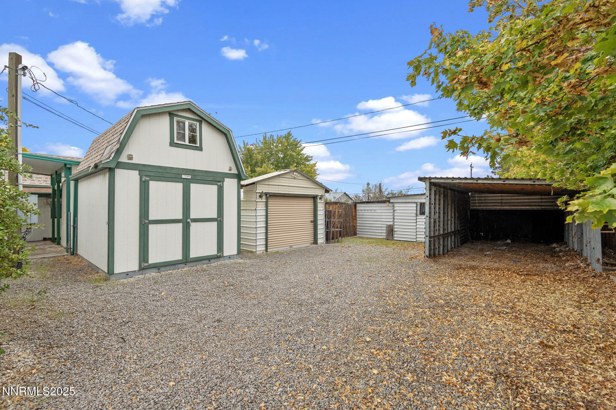 180 Staci Way Sun Valley, NV 89433 - Photo 57 of 71 a front view of a house with a yard and garage
