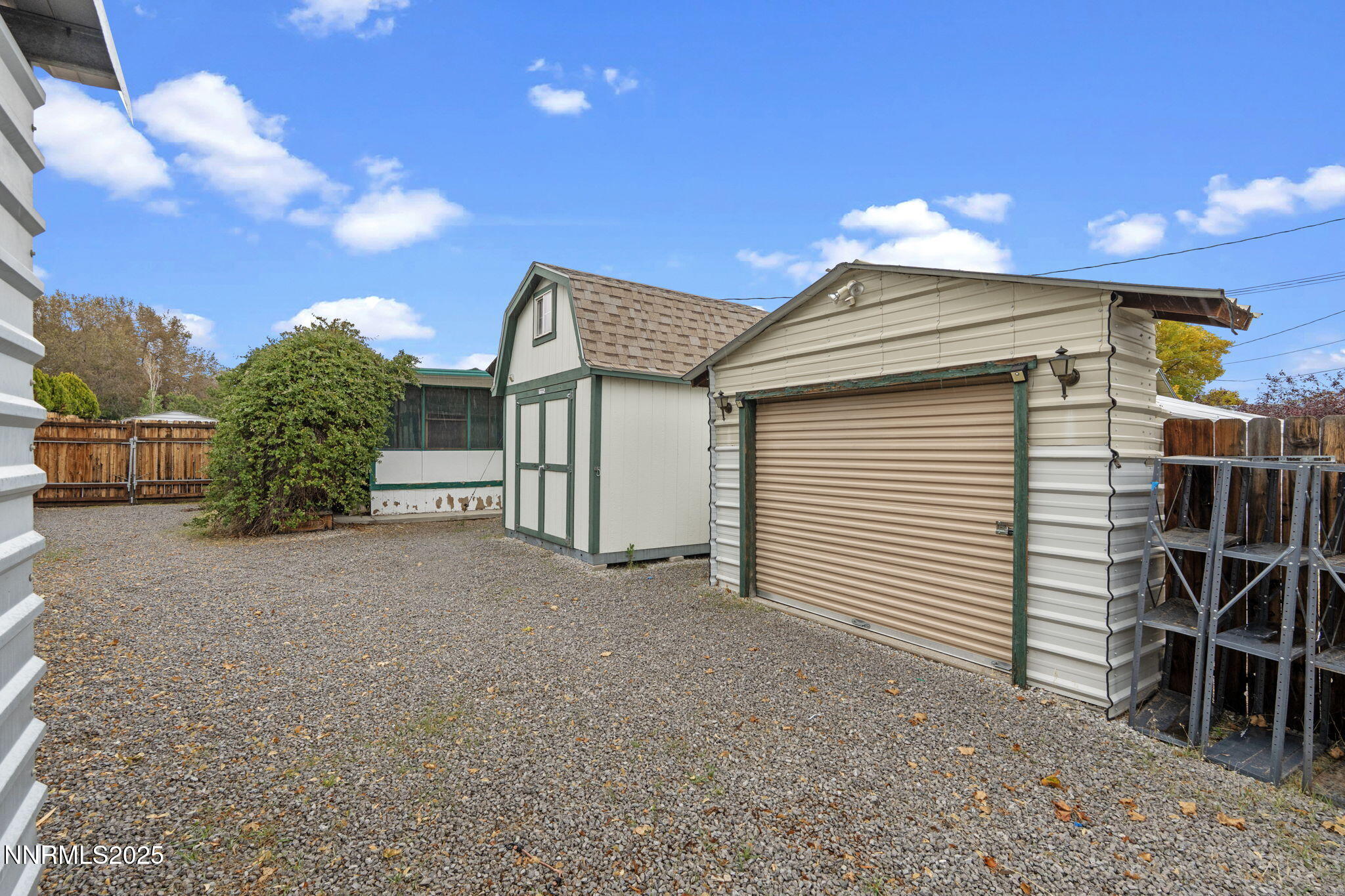 180 Staci Way Sun Valley, NV 89433 - Photo 58 of 71 a view of a house with a yard and garage