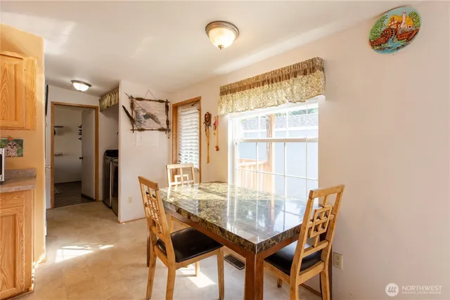 a dining room with furniture and window