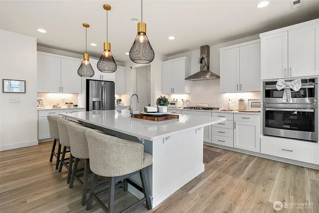 a kitchen with a sink cabinets and stainless steel appliances