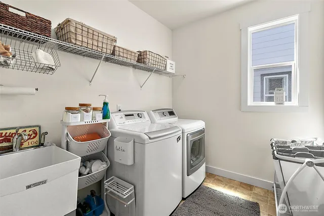 a utility room with dryer and washer