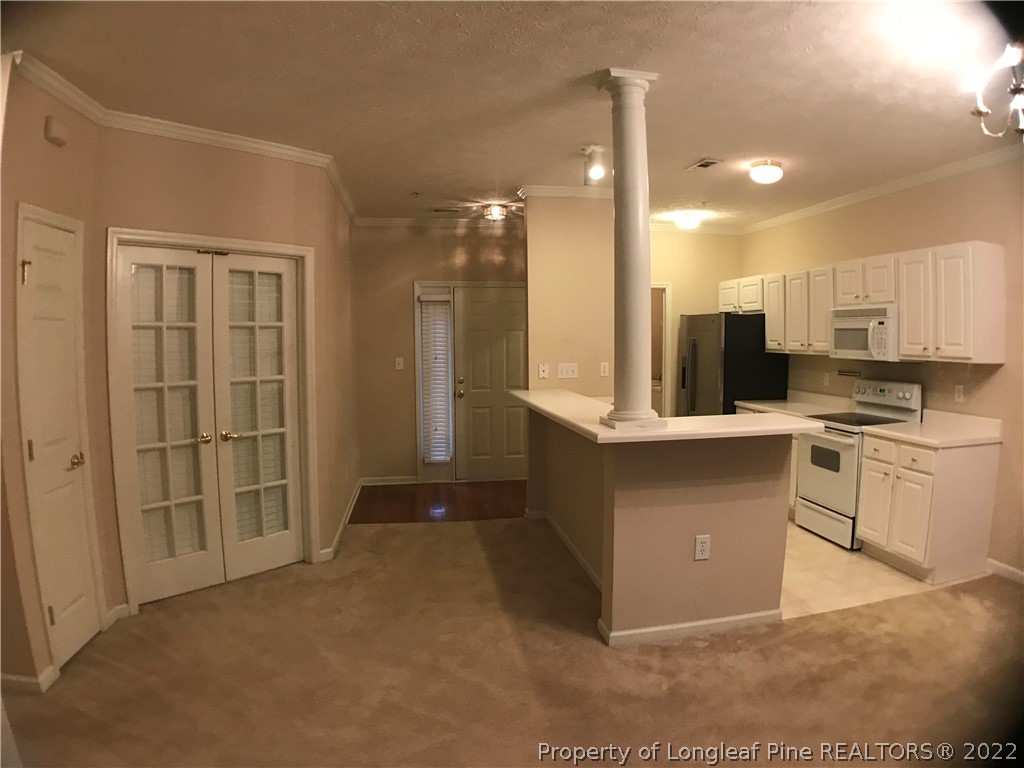 522 Lionshead Road, Unit 3 Fayetteville, NC 28311 - Photo 12 of 20 a view of kitchen with cabinets and refrigerator
