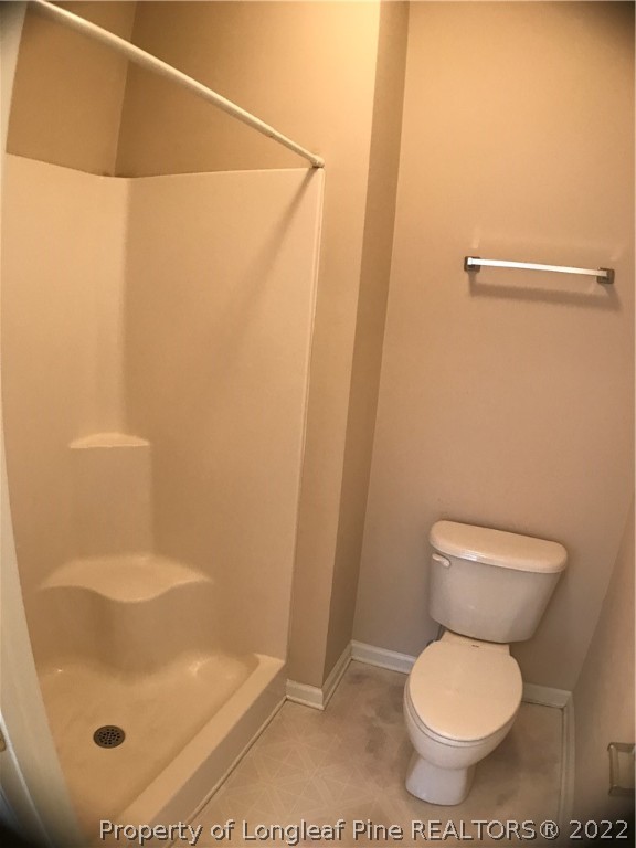 522 Lionshead Road, Unit 3 Fayetteville, NC 28311 - Photo 19 of 20 a white toilet sitting next to a shower