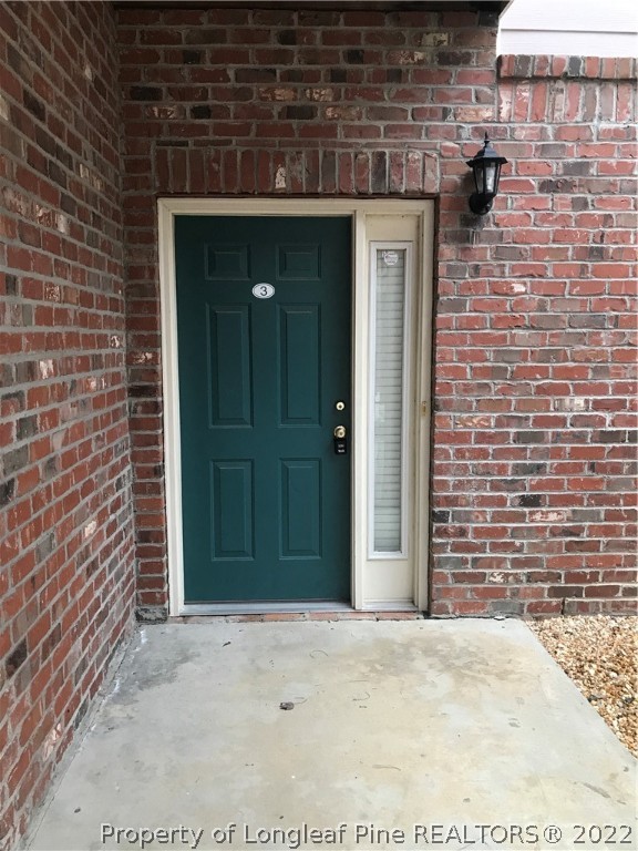 522 Lionshead Road, Unit 3 Fayetteville, NC 28311 - Photo 3 of 20 a front view of a house with a wooden fence