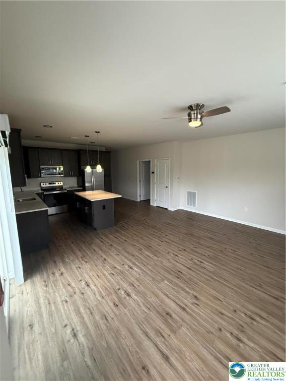 1036 Blake Street, Unit 101 Bethlehem, PA 18017 - Photo 5 of 12 a living room with furniture and a wooden floor