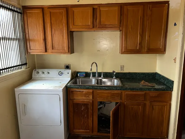 a utility room with dryer and washer