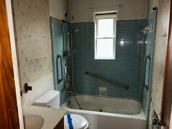 a view of an empty room with a window