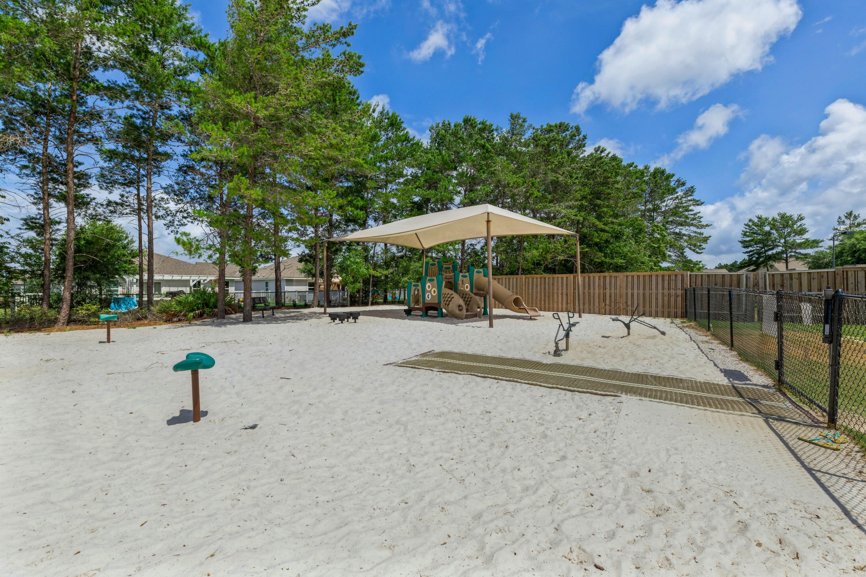 525 Windchime Way Freeport, FL 32439 - Photo 54 of 59 a view of outdoor space with garden and trees