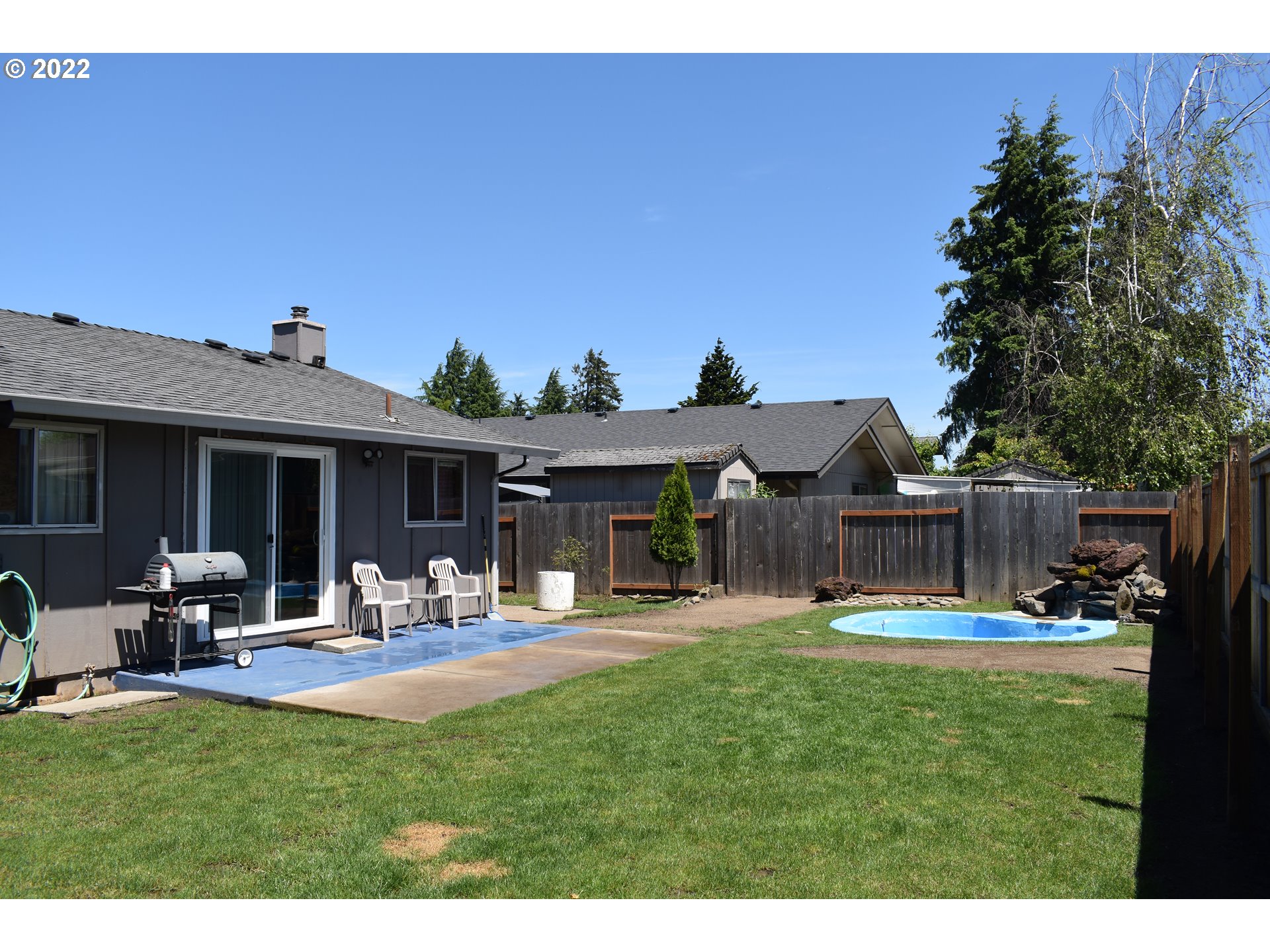 531 T Street Springfield, OR 97477 - Photo 14 of 17 a view of a house with backyard porch and sitting area