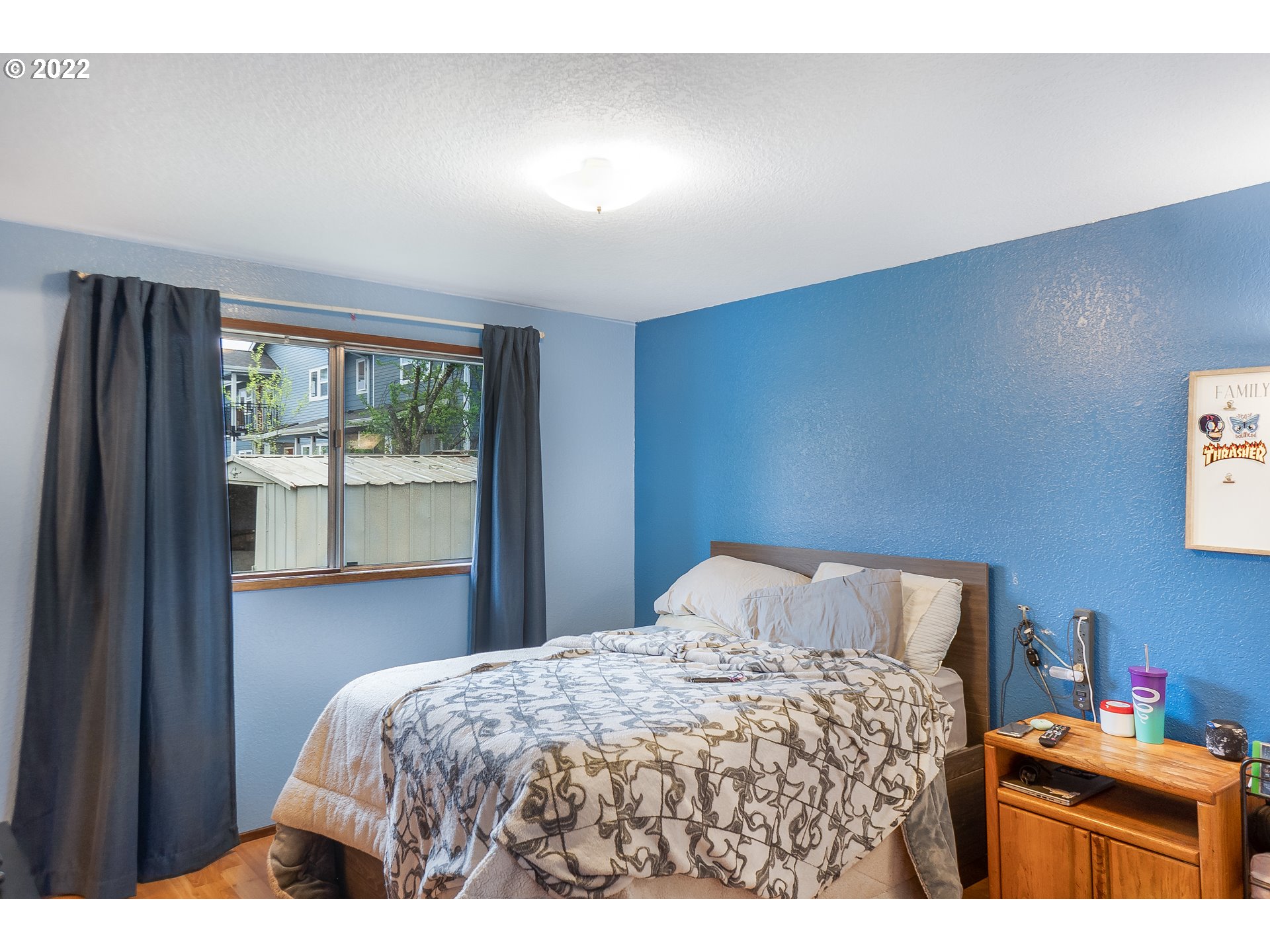 531 T Street Springfield, OR 97477 - Photo 8 of 17 a bedroom with a bed and a window