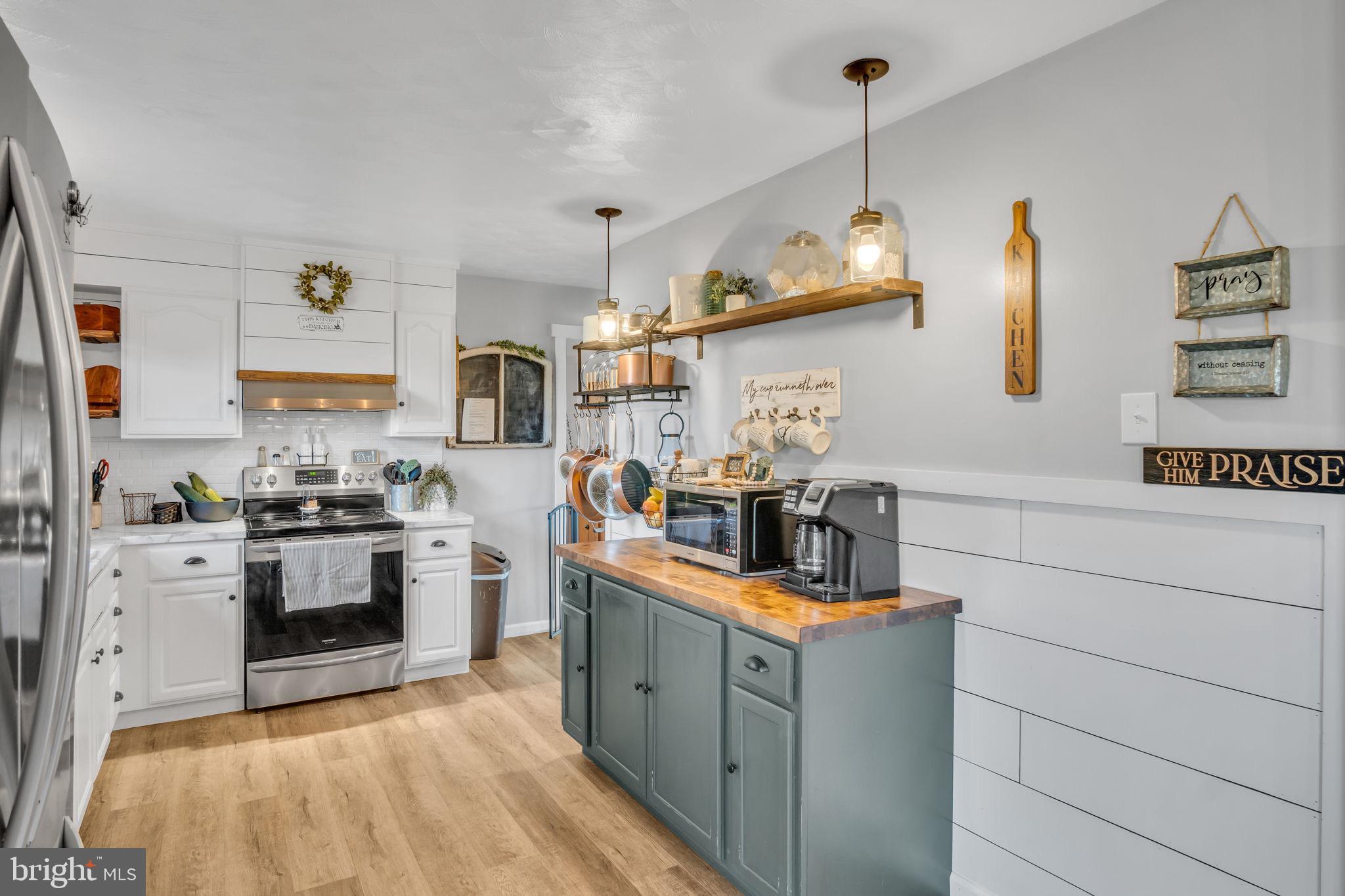623 Bloserville Road Newville, PA 17241 - Photo 12 of 49 a kitchen with stainless steel appliances granite countertop a sink stove and refrigerator