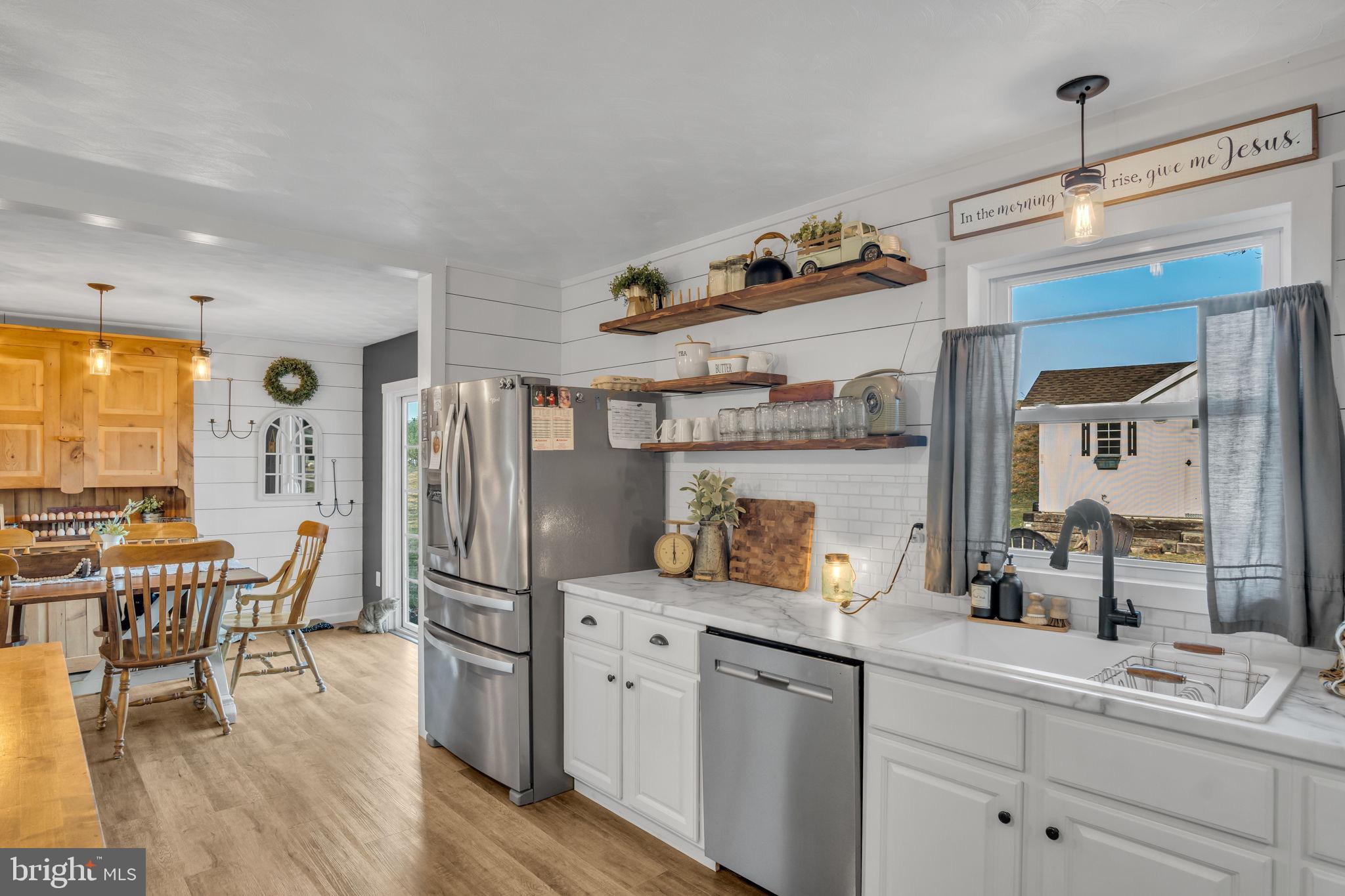 623 Bloserville Road Newville, PA 17241 - Photo 14 of 49 a kitchen with stainless steel appliances granite countertop a refrigerator and a dining table