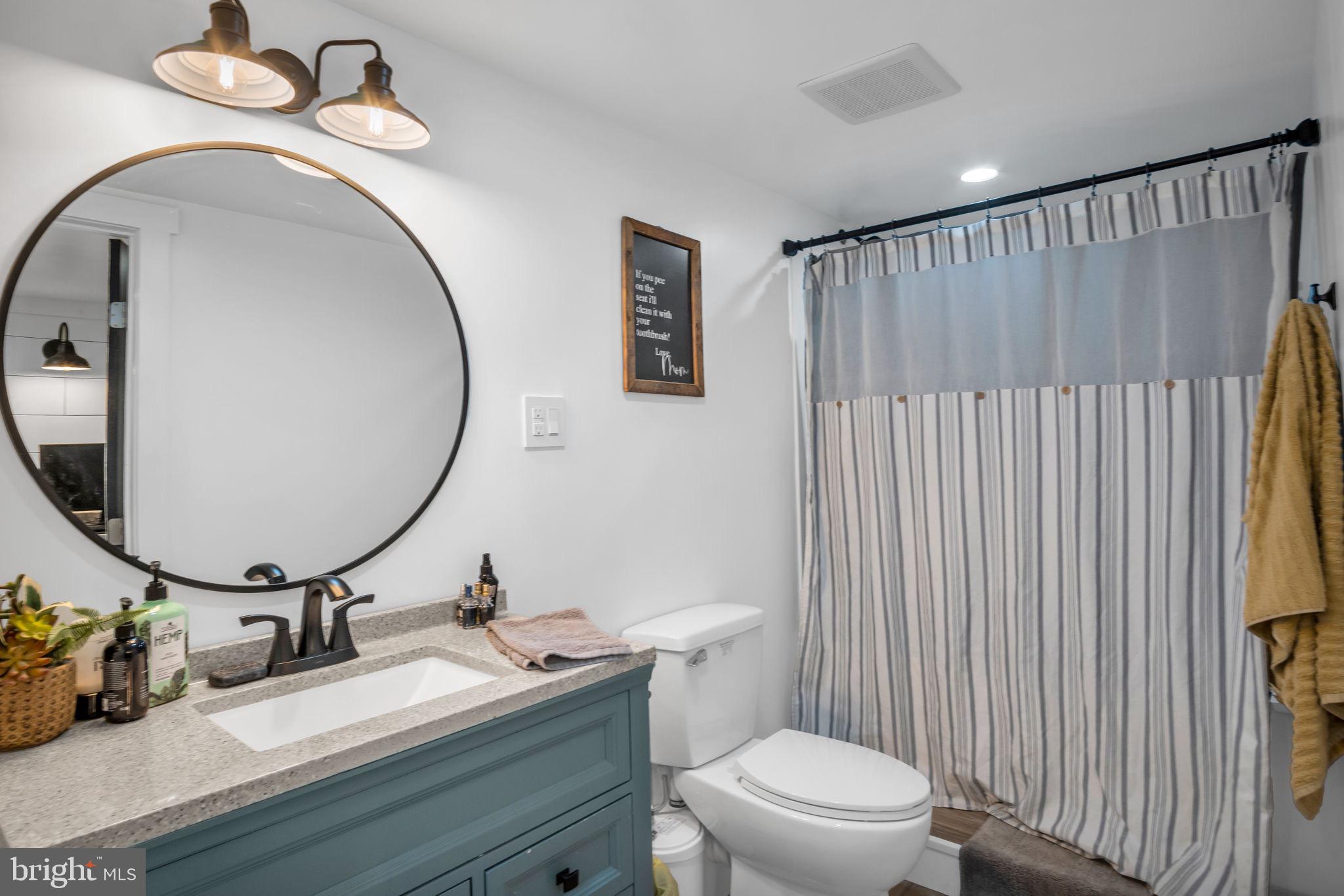 623 Bloserville Road Newville, PA 17241 - Photo 36 of 49 a bathroom with a toilet a sink and mirror