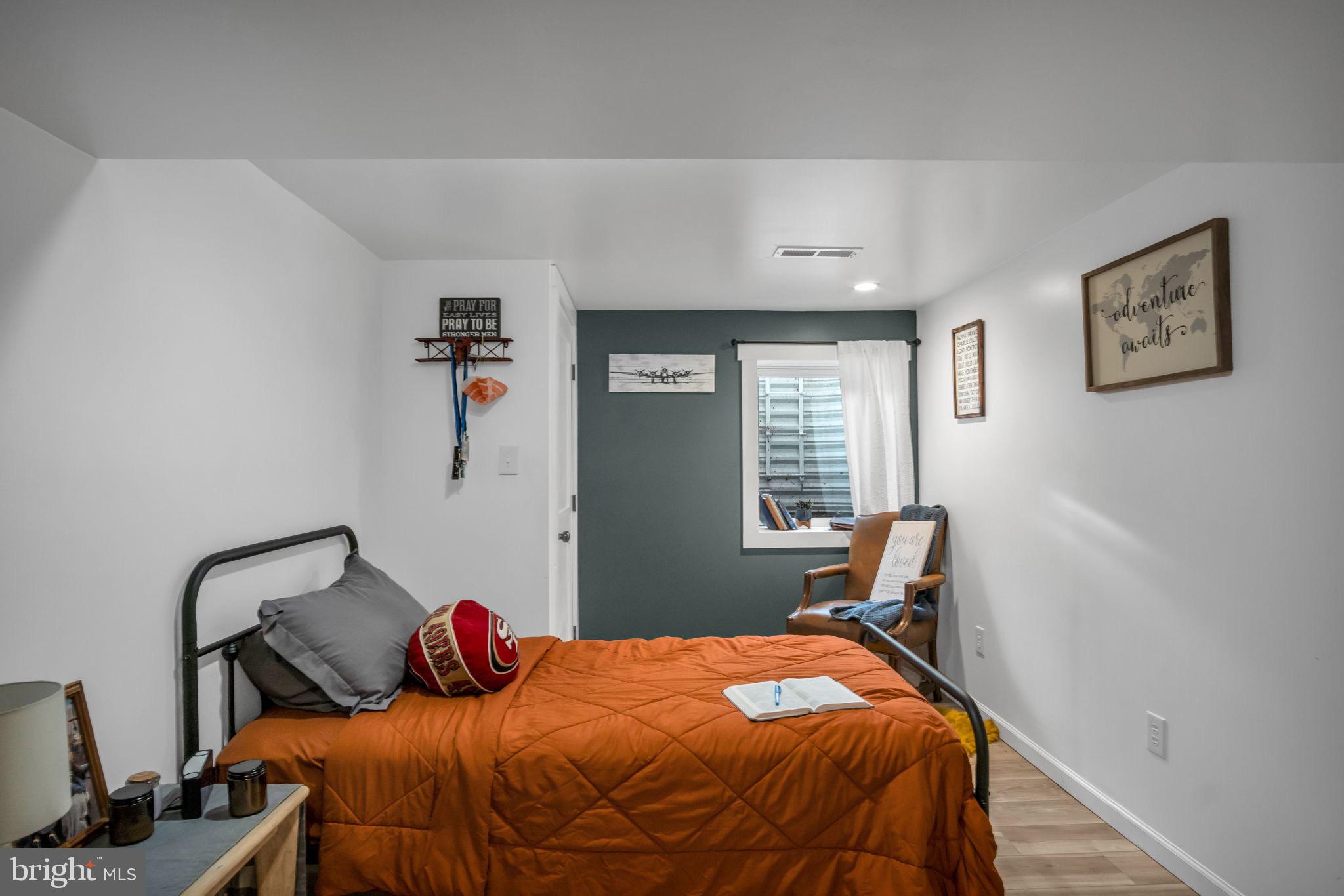 623 Bloserville Road Newville, PA 17241 - Photo 37 of 49 a bedroom with a bed and wooden floor