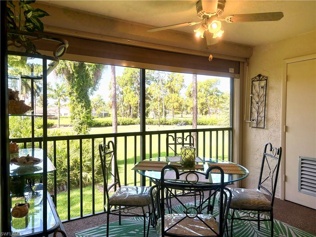 5841 Rattlesnake Hammock Road, Unit I203 Naples, FL 34113 - Photo 14 of 24 a view of a dining room with furniture window and outside view
