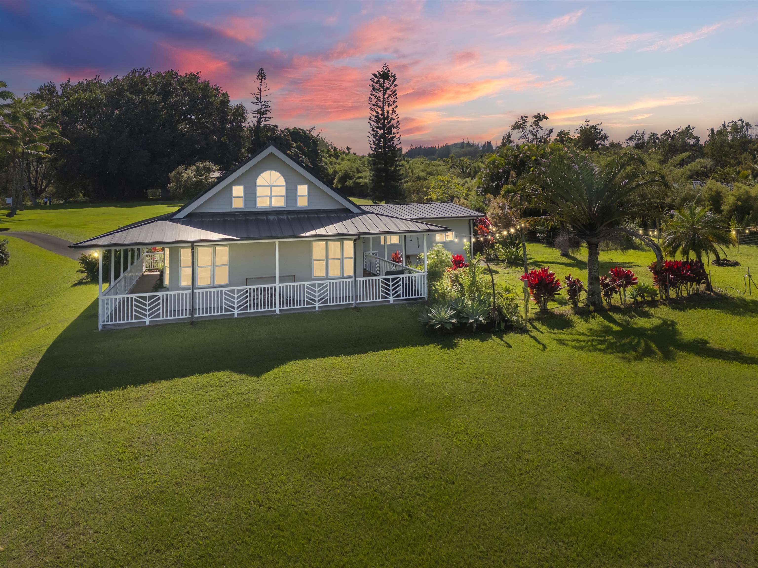 a front view of a house with garden
