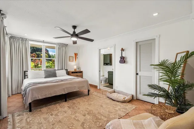 a bedroom with a bed and a couch