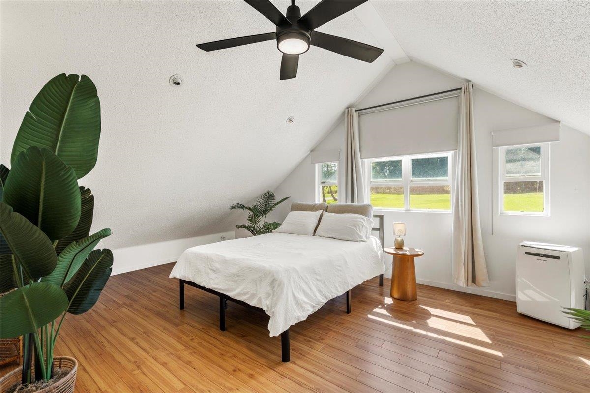 44 Kaupakalua Road Haiku, HI 96708 - Photo 24 of 48 a bedroom with a bed dresser and a window