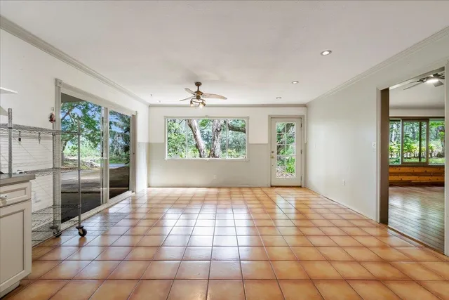 a kitchen with cabinets and stainless steel appliances