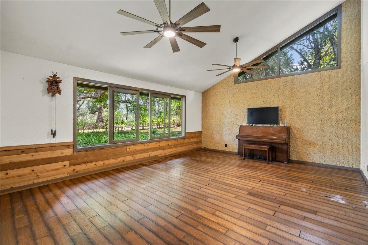 44 Kaupakalua Road Haiku, HI 96708 - Photo 41 of 48 a view of room with wooden floor and ceiling fan