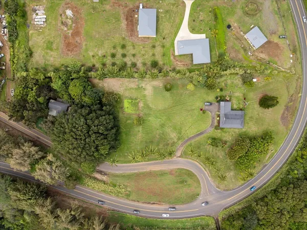 an aerial view of a residential houses with outdoor space