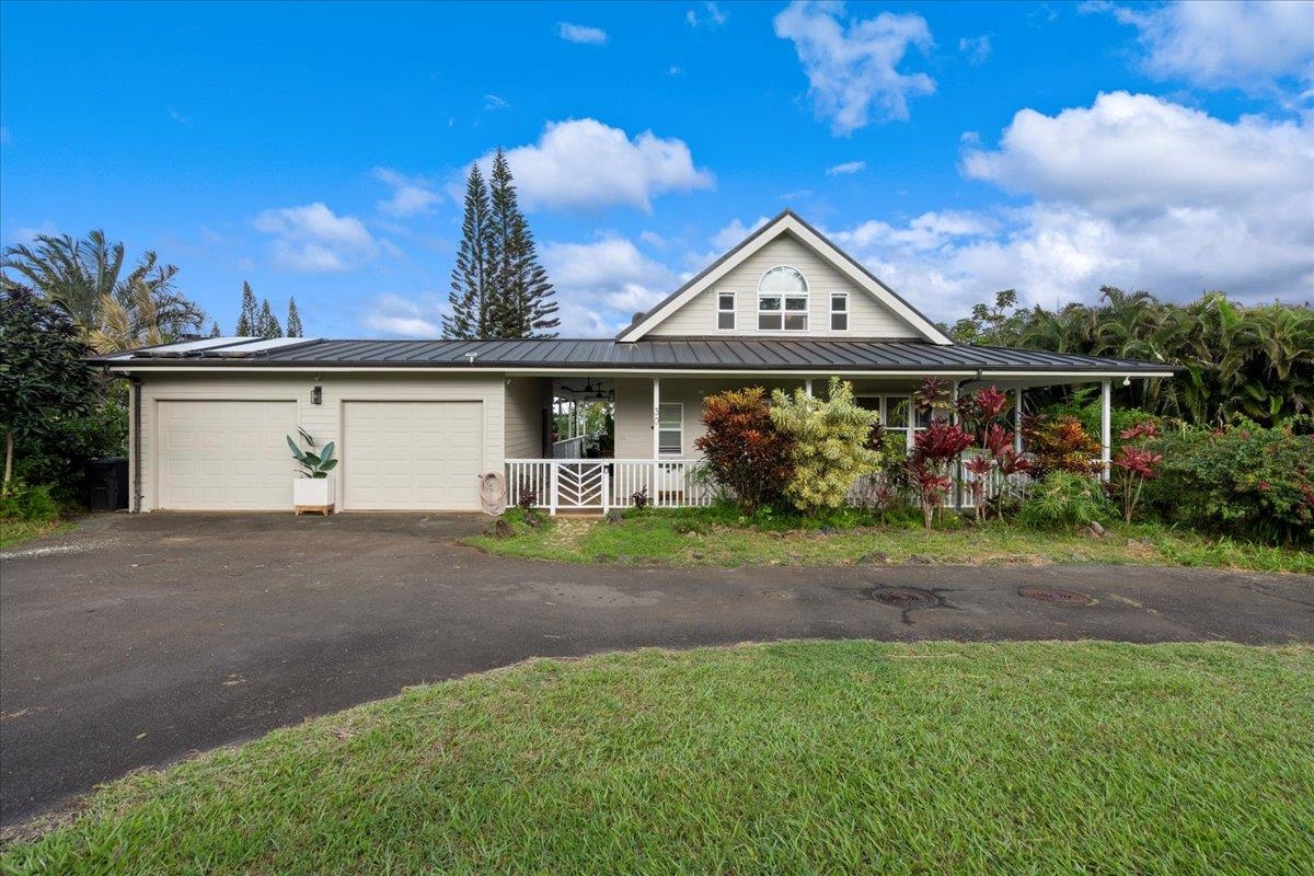44 Kaupakalua Road Haiku, HI 96708 - Photo 9 of 48 a view of front of house with a yard and potted plants