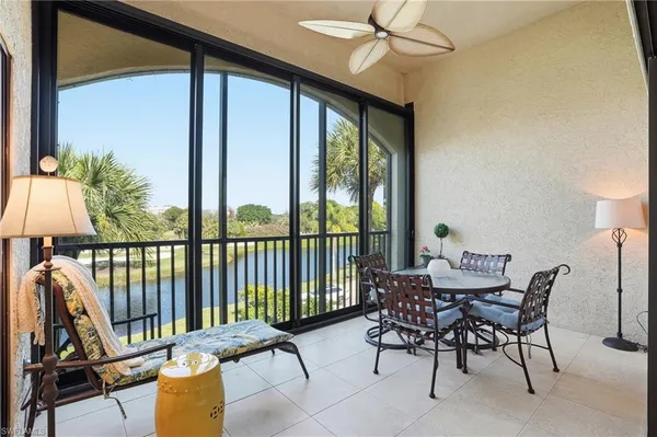 a view of a balcony with furniture