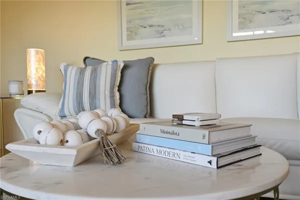 a living room with furniture and a table