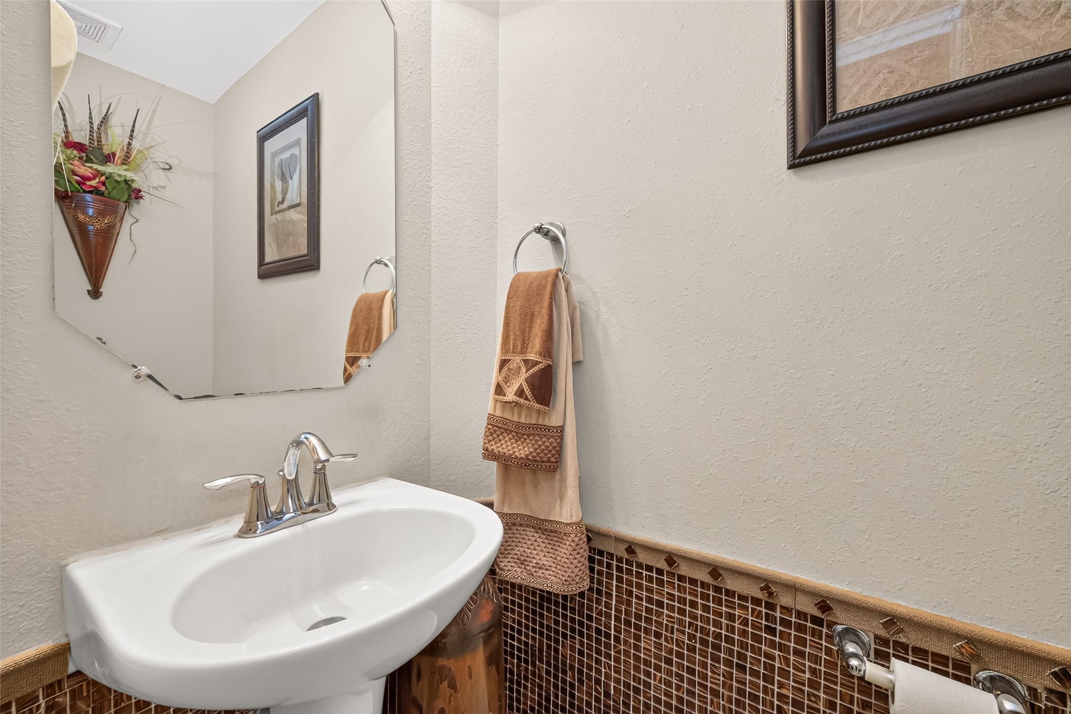 22007 Bridgestone Hawk Court Spring, TX 77388 - Photo 25 of 50 A pedestal sink gives the half bath a classic touch, while the compact layout makes efficient use of the space near the main living areas.