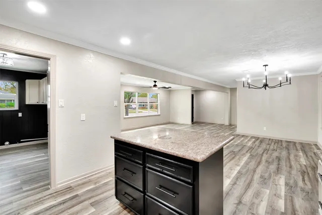 a view of kitchen island with wooden floor
