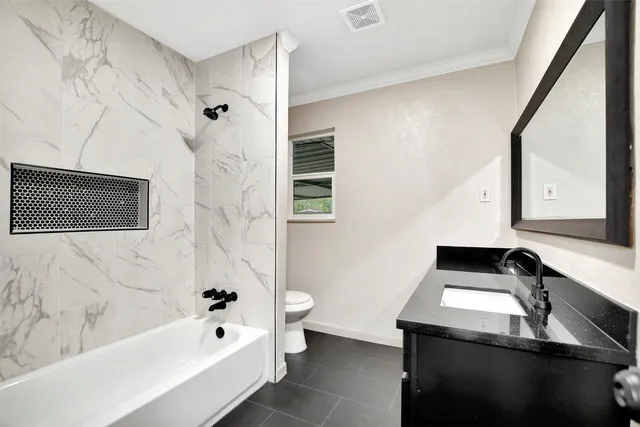 a bathroom with a sink and a bathtub