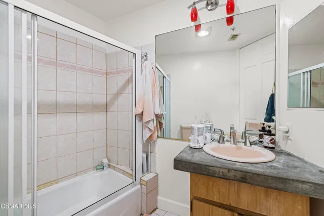 a bathroom with a sink and mirror